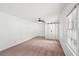 Bright bedroom featuring neutral carpet, barn door closet and windows for ample light at 742 Redland Dr, Jonesboro, GA 30238
