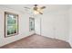 Bright bedroom with neutral walls and carpeted flooring, complemented by two large windows at 742 Redland Dr, Jonesboro, GA 30238