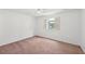 Bright bedroom with large window, soft carpet, and neutral color palette at 742 Redland Dr, Jonesboro, GA 30238