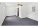 Bedroom with neutral walls, sliding closet, and a ceiling fan with light fixture at 742 Redland Dr, Jonesboro, GA 30238
