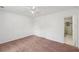 Bright bedroom featuring neutral walls, carpet flooring, ceiling fan, and access to a bathroom at 742 Redland Dr, Jonesboro, GA 30238