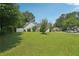 Well maintained front yard with a green lawn and shrubs in front of a home under a blue sky at 742 Redland Dr, Jonesboro, GA 30238