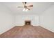 View of the Living Room featuring a classic fireplace and a ceiling fan at 742 Redland Dr, Jonesboro, GA 30238