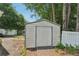 A metal shed featuring a door, with a metal roof at 742 Redland Dr, Jonesboro, GA 30238