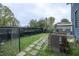 Backyard has a stone path leading to a deck area with potential for gardening or outdoor activities at 117 Joseph E Lowery Nw Blvd, Atlanta, GA 30314