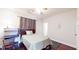Bedroom complete with hardwood floors, ceiling fan, desk, and closet at 117 Joseph E Lowery Nw Blvd, Atlanta, GA 30314
