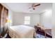 Bright bedroom with a ceiling fan, window, and wooden desk provides ample natural light at 117 Joseph E Lowery Nw Blvd, Atlanta, GA 30314