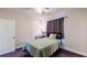 Cozy bedroom features a twin bed, wooden floors, and a small desk for a student or guest at 117 Joseph E Lowery Nw Blvd, Atlanta, GA 30314