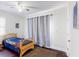 Bedroom features hardwood floors, window view, ceiling fan, and closet at 117 Joseph E Lowery Nw Blvd, Atlanta, GA 30314