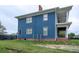 Side view of a blue two-story home, featuring ample windows and an upper level porch at 117 Joseph E Lowery Nw Blvd, Atlanta, GA 30314