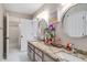 Bathroom featuring dual sinks, granite countertops, and updated fixtures at 2425 Hamptons Psge, Alpharetta, GA 30005