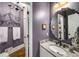 Stylish bathroom with marble countertop, decorative mirror, and modern fixtures at 2425 Hamptons Psge, Alpharetta, GA 30005