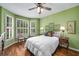 Bedroom with hardwood floors, neutral-toned walls, and a bright window at 2425 Hamptons Psge, Alpharetta, GA 30005