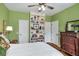 Cozy bedroom featuring a built-in bookshelf and hardwood floors at 2425 Hamptons Psge, Alpharetta, GA 30005