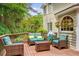 Outdoor deck with comfortable seating, mature trees, and space for entertaining at 2425 Hamptons Psge, Alpharetta, GA 30005