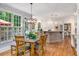 Spacious kitchen with dining area, granite countertops, stainless appliances, and natural light at 2425 Hamptons Psge, Alpharetta, GA 30005