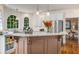 Gourmet kitchen with stainless appliances, granite countertops, and an arched window at 2425 Hamptons Psge, Alpharetta, GA 30005