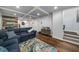 Finished basement featuring a comfortable seating area, and coffered ceilings at 2425 Hamptons Psge, Alpharetta, GA 30005