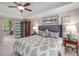 Main bedroom with tray ceilings and private access to a bathroom at 2425 Hamptons Psge, Alpharetta, GA 30005
