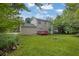 Expansive backyard featuring a red deck perfect for outdoor entertaining at 2584 Shadowbrook Dr, Decatur, GA 30034