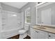 Bright bathroom featuring a shower-tub combo and vanity with modern fixtures at 2584 Shadowbrook Dr, Decatur, GA 30034