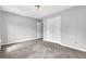 Neutral bedroom featuring carpeted floors, closet, and gray walls providing a cozy and inviting space at 2584 Shadowbrook Dr, Decatur, GA 30034