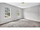 Bright bedroom with a view features carpeted floors, natural light, and gray walls at 2584 Shadowbrook Dr, Decatur, GA 30034