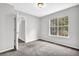 Bright bedroom with a view features carpeted floors, natural light, and gray walls at 2584 Shadowbrook Dr, Decatur, GA 30034