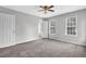 Bright bedroom featuring carpeted floors, ceiling fan, and gray walls providing a cozy and inviting space at 2584 Shadowbrook Dr, Decatur, GA 30034