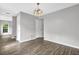Dining area with hardwood floors and a stylish chandelier at 2584 Shadowbrook Dr, Decatur, GA 30034