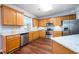 Well-equipped kitchen with stainless steel appliances, granite countertops, and wooden cabinets at 2715 Haynes Club Circle, Grayson, GA 30017
