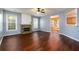 Inviting living room featuring hardwood floors, a stone fireplace, and ample natural light at 2715 Haynes Club Circle, Grayson, GA 30017