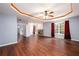 Spacious main bedroom with hardwood floors, fireplace, tray ceiling and large windows at 2715 Haynes Club Circle, Grayson, GA 30017