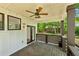 Relaxing covered back porch with ceiling fan and view of the backyard at 515 Cohen St, Atlanta, GA 30310