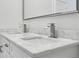 Close up of bathroom vanity with marble countertop and double sinks with modern waterfall faucets at 515 Cohen St, Atlanta, GA 30310