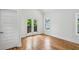 Bright bedroom featuring hardwood floors, french doors to balcony, and natural light at 515 Cohen St, Atlanta, GA 30310