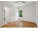 Bedroom featuring hardwood floors, neutral walls, and a modern ceiling fan for added comfort at 515 Cohen St, Atlanta, GA 30310