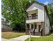 Charming two-story home featuring a covered porch, balcony, and modern farmhouse design elements at 515 Cohen St, Atlanta, GA 30310