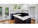 Modern kitchen featuring white cabinets, dark countertops, and stainless steel appliances at 515 Cohen St, Atlanta, GA 30310
