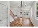 Well-lit living room showcasing hardwood floors, modern lighting, and staircase at 515 Cohen St, Atlanta, GA 30310