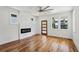 Bright living room featuring hardwood floors, fireplace, and modern lighting at 515 Cohen St, Atlanta, GA 30310