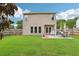 Spacious backyard with lush green grass, a patio area, and a privacy fence, creating a serene outdoor retreat at 5225 Stonehaven Vw, Cumming, GA 30040
