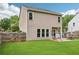 A well-maintained backyard offers a patio, a grill, green grass and a wooden fence for privacy at 5225 Stonehaven Vw, Cumming, GA 30040