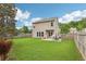Expansive backyard with a well-maintained lawn, privacy fence, and patio area, great for outdoor entertaining and relaxation at 5225 Stonehaven Vw, Cumming, GA 30040