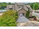 Elegant community clubhouse featuring stone architecture, a grand entrance staircase, and mature landscaping at 5225 Stonehaven Vw, Cumming, GA 30040