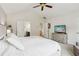 Bright main bedroom with ceiling fan, ensuite access, neutral walls, and plush carpeting at 5225 Stonehaven Vw, Cumming, GA 30040