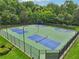 Aerial view of multiple sports courts featuring tennis, pickleball, and basketball within a gated community at 5225 Stonehaven Vw, Cumming, GA 30040