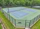 Well-maintained tennis courts with new nets in a fenced-in area within the community at 5225 Stonehaven Vw, Cumming, GA 30040