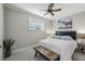 Neutral bedroom featuring a picture window, ceiling fan, and minimalist decor at 604 Timm Valley Ne Rd # A, Atlanta, GA 30305