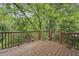 Outdoor deck with wood railing, offering a private space for outdoor living at 604 Timm Valley Ne Rd # A, Atlanta, GA 30305